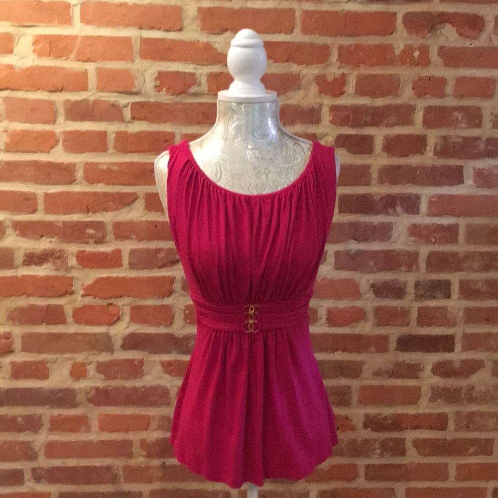 Bebe camisole with rushing detail and gold detail.